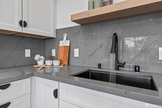 a bedroom with bed and a potted plant