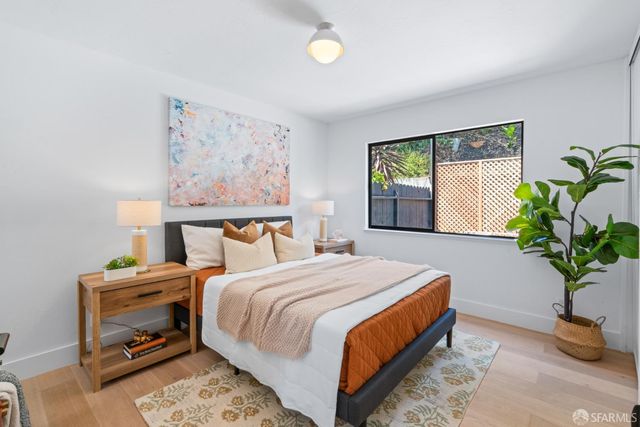 a bathroom with a sink mirror and vanity