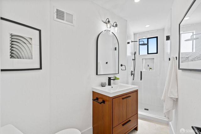 a bedroom with a bed and a cabinets