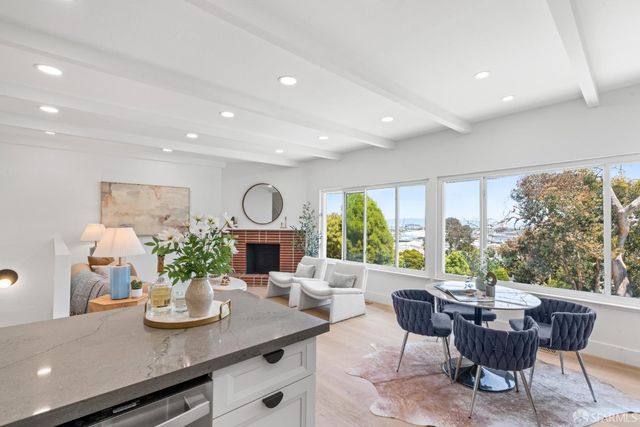 a view of a dining room with furniture window and outside view