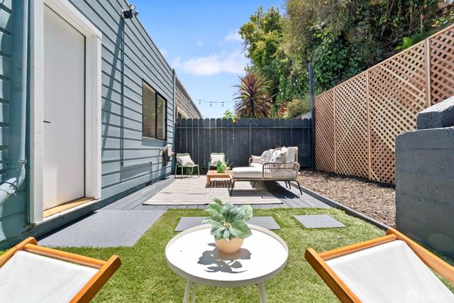 an aerial view of a house with parking