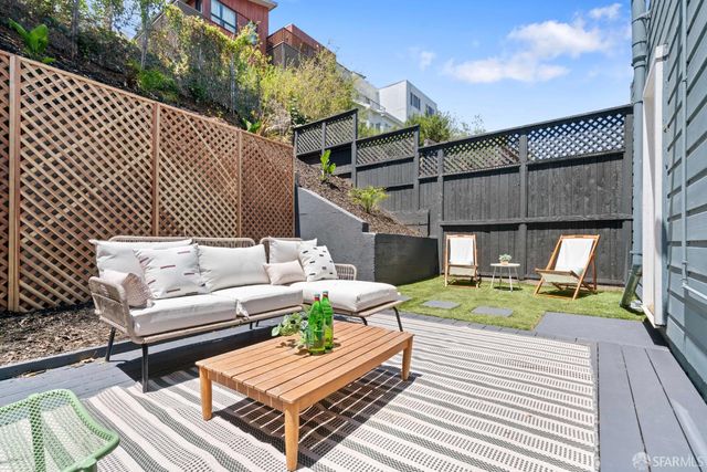 an aerial view of a houses with yard