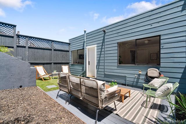 an aerial view of residential houses with green space