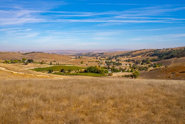 a view of an ocean and a mountain