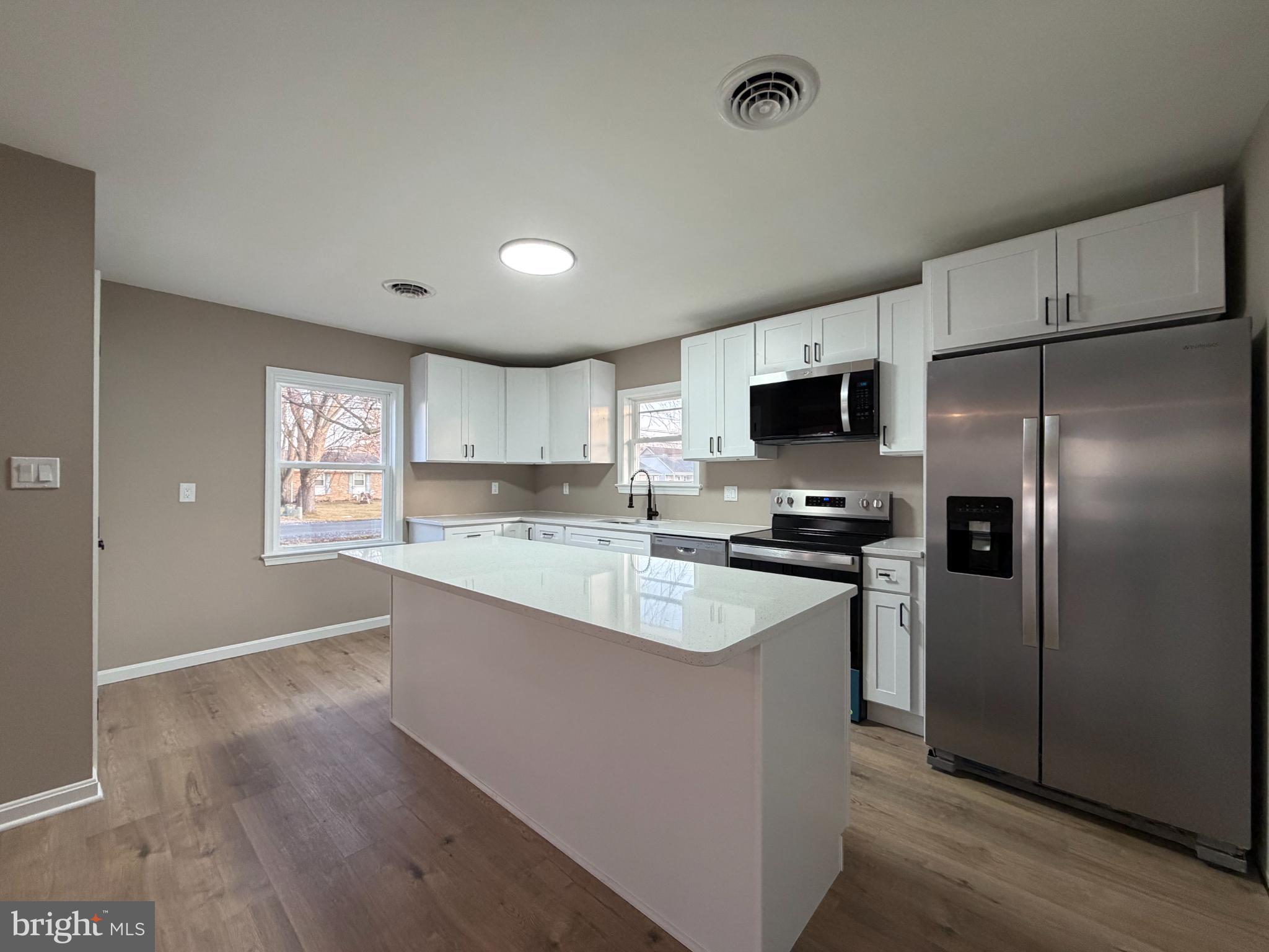 1906 Harbor Drive Chester, MD 21619 - Photo 11 of 44 a large kitchen with a stove a refrigerator and a sink