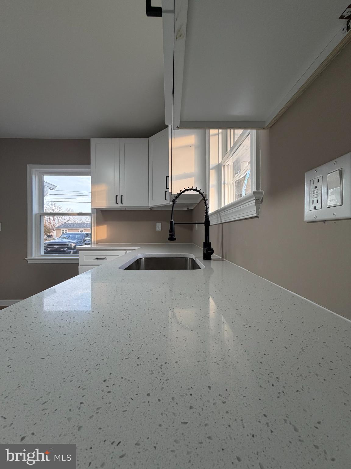1906 Harbor Drive Chester, MD 21619 - Photo 14 of 44 a kitchen with granite countertop a sink cabinets and a window