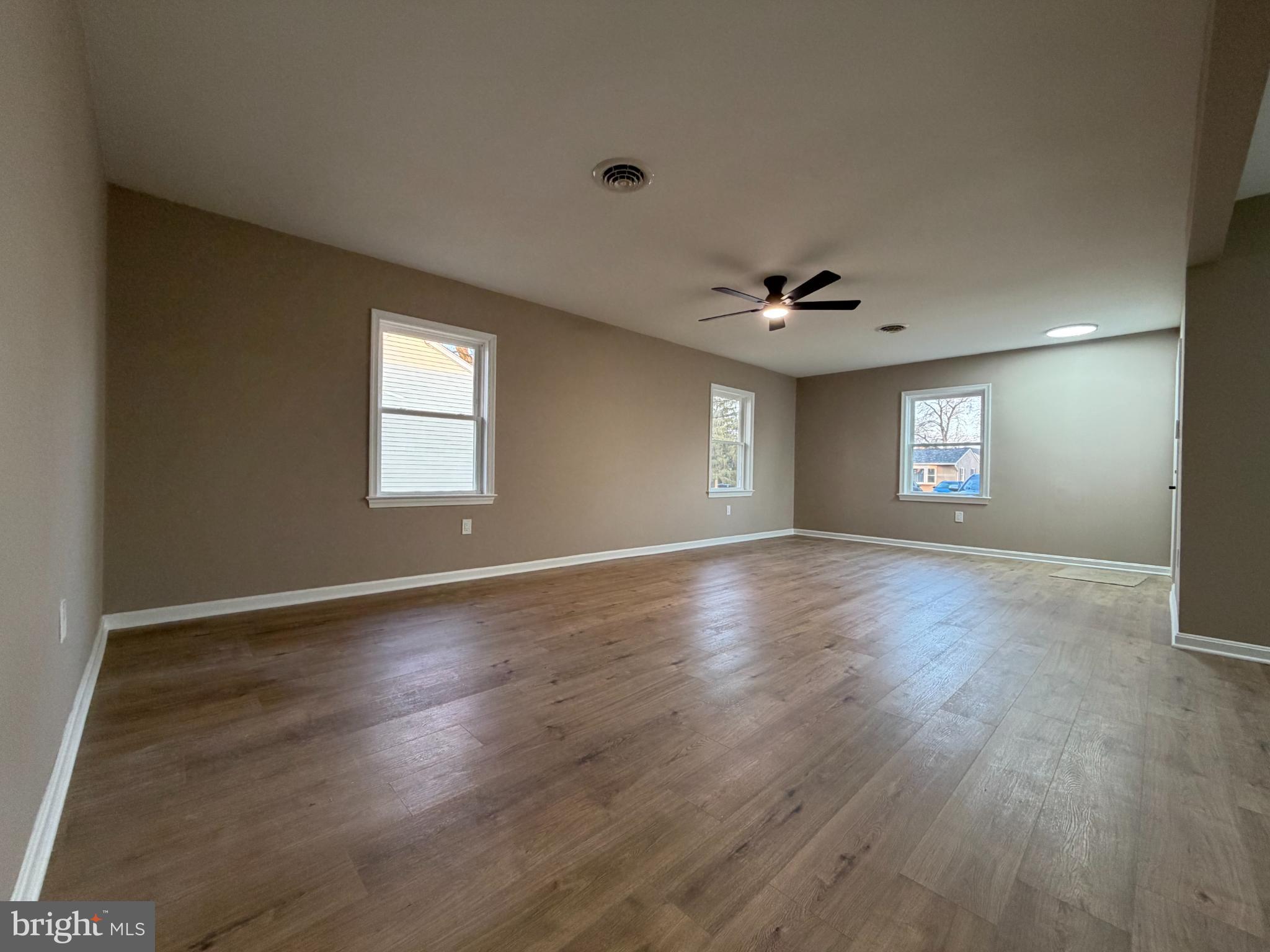 1906 Harbor Drive Chester, MD 21619 - Photo 20 of 44 a view of an empty room with wooden floor and a window