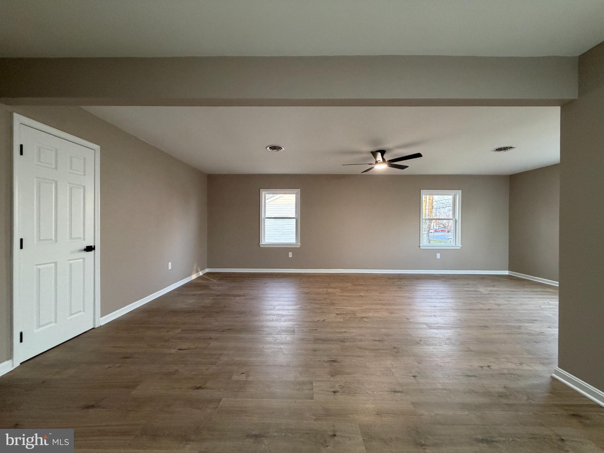 1906 Harbor Drive Chester, MD 21619 - Photo 21 of 44 a view of an empty room with window and wooden floor