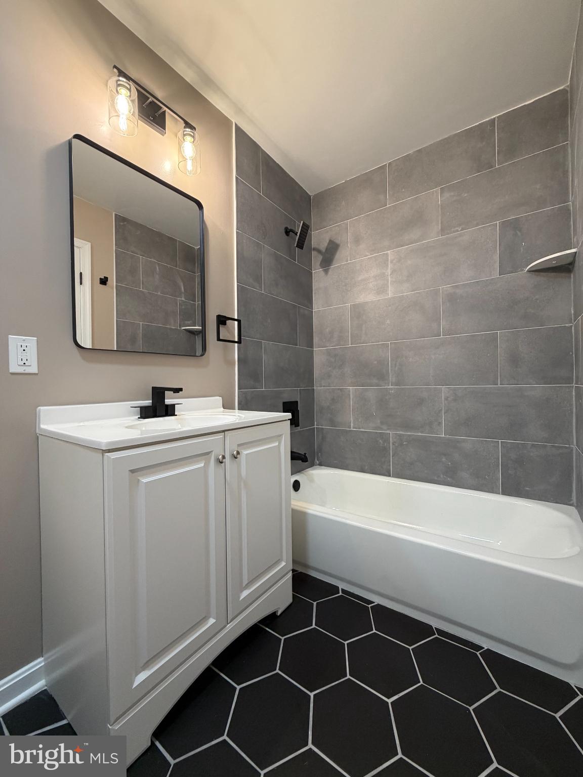 1906 Harbor Drive Chester, MD 21619 - Photo 23 of 44 a bathroom with a bathtub a sink a toilet and a mirror