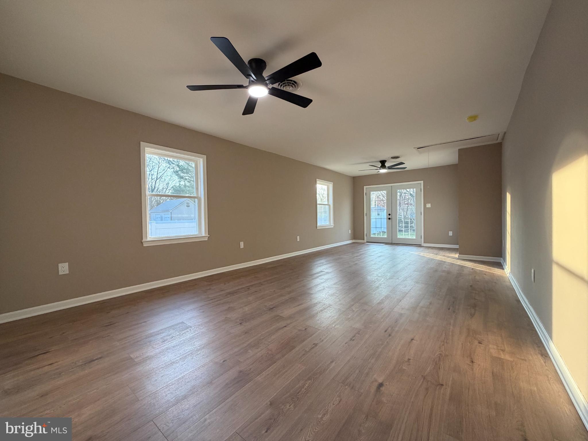1906 Harbor Drive Chester, MD 21619 - Photo 31 of 44 a view of an empty room with wooden floor and a window