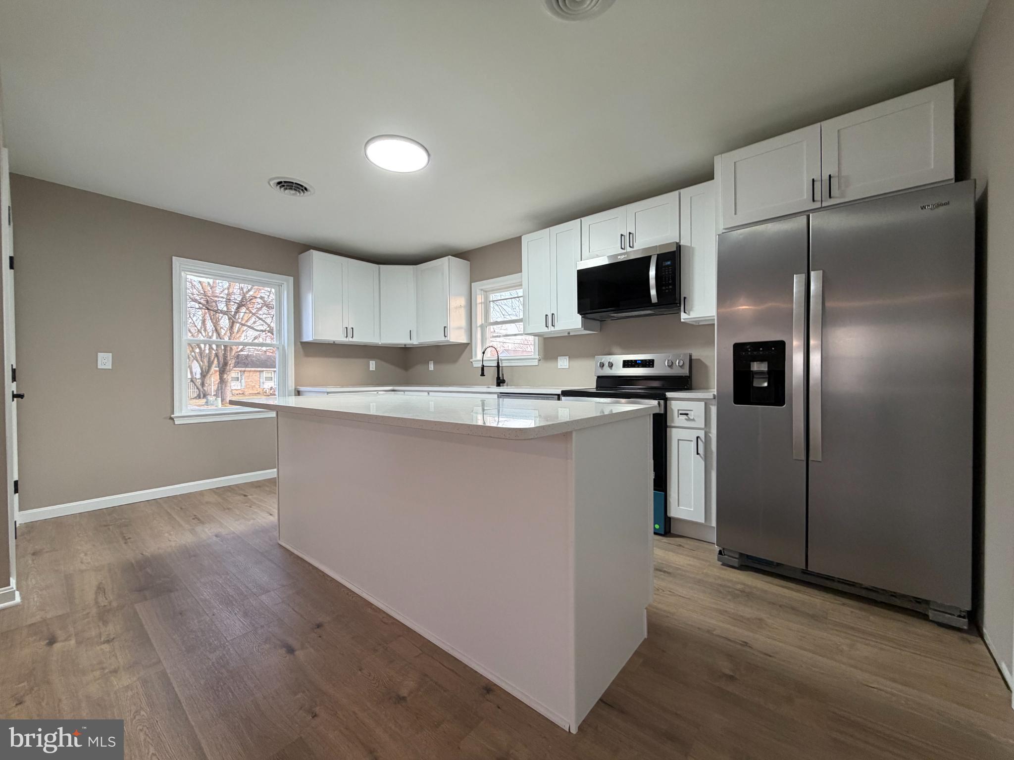 1906 Harbor Drive Chester, MD 21619 - Photo 10 of 44 a kitchen with stainless steel appliances granite countertop a refrigerator sink and microwave