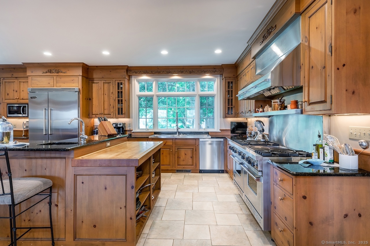 19 Seherr Thoss Drive Litchfield, CT 06759 - Photo 12 of 37 a kitchen with stainless steel appliances granite countertop a stove a sink and a microwave