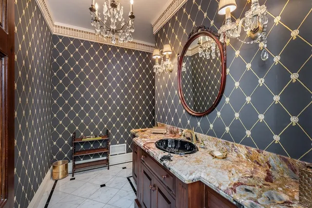 a kitchen with a stove a sink and a dining table