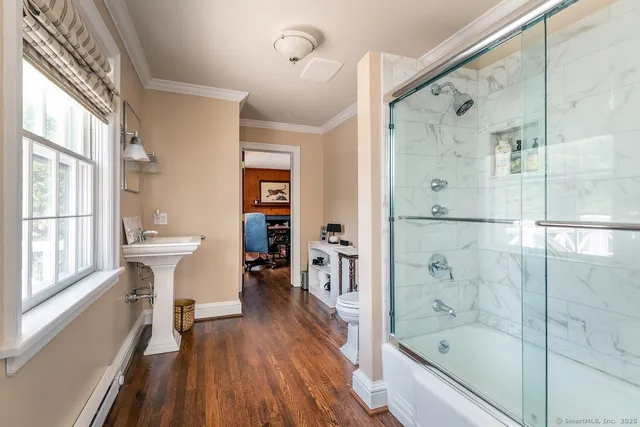a bathroom with a bathtub and a shower