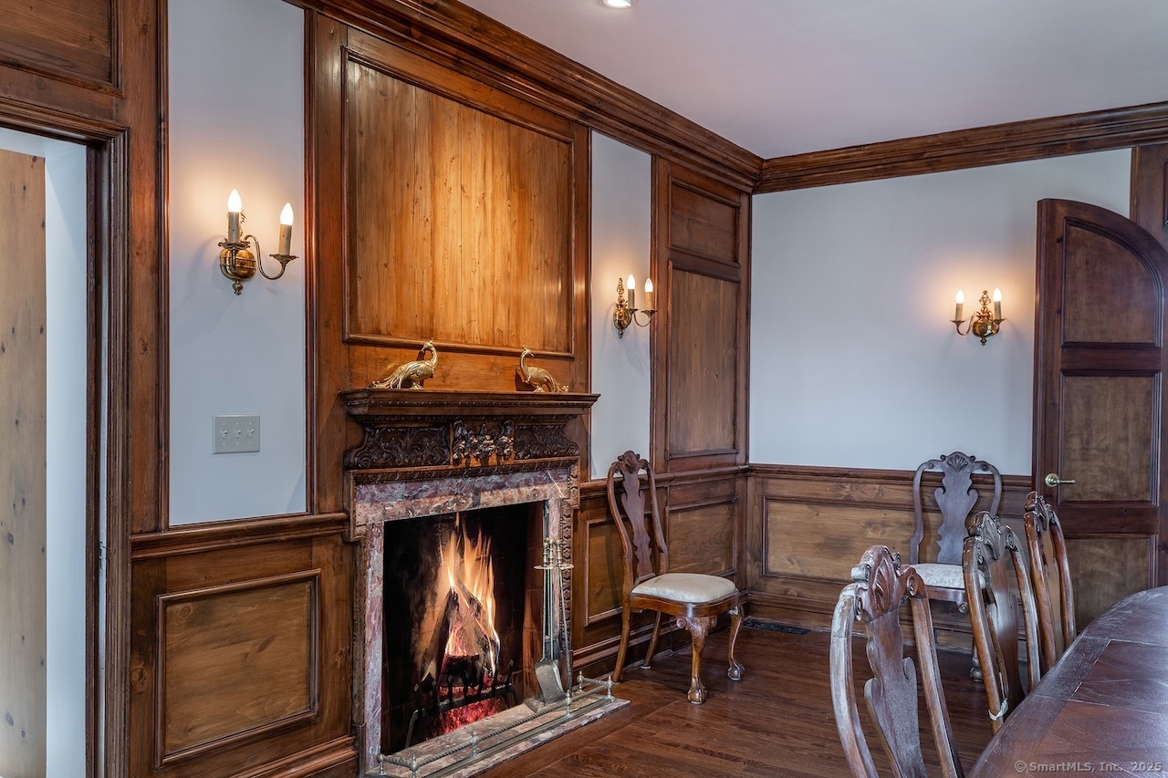 19 Seherr Thoss Drive Litchfield, CT 06759 - Photo 7 of 37 a view of a livingroom with furniture and a fireplace