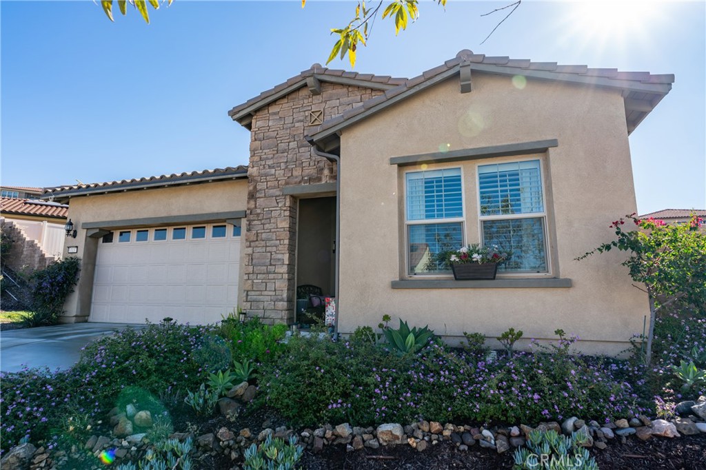 11137 Briar Rose Court Corona, CA 92883 - Photo 7 of 75 a front view of a house with garden