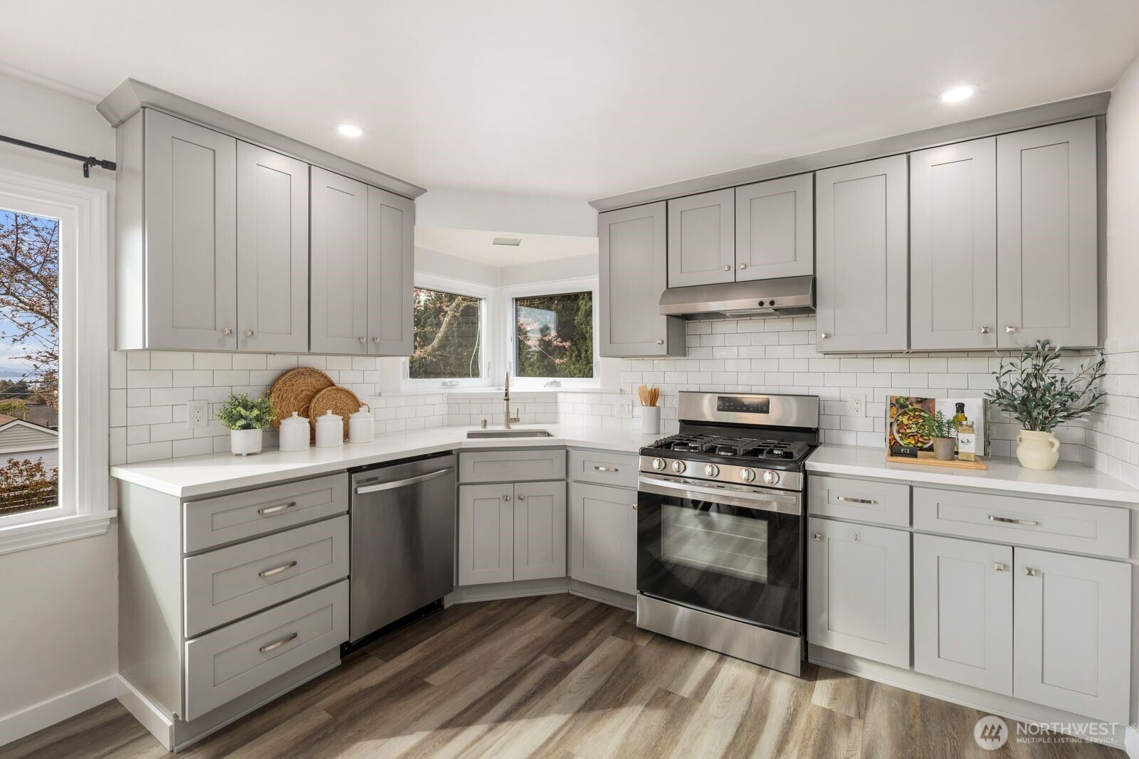 6023 35th Avenue Southwest Seattle, WA 98126 - Photo 12 of 38 a kitchen with cabinets stainless steel appliances and a window