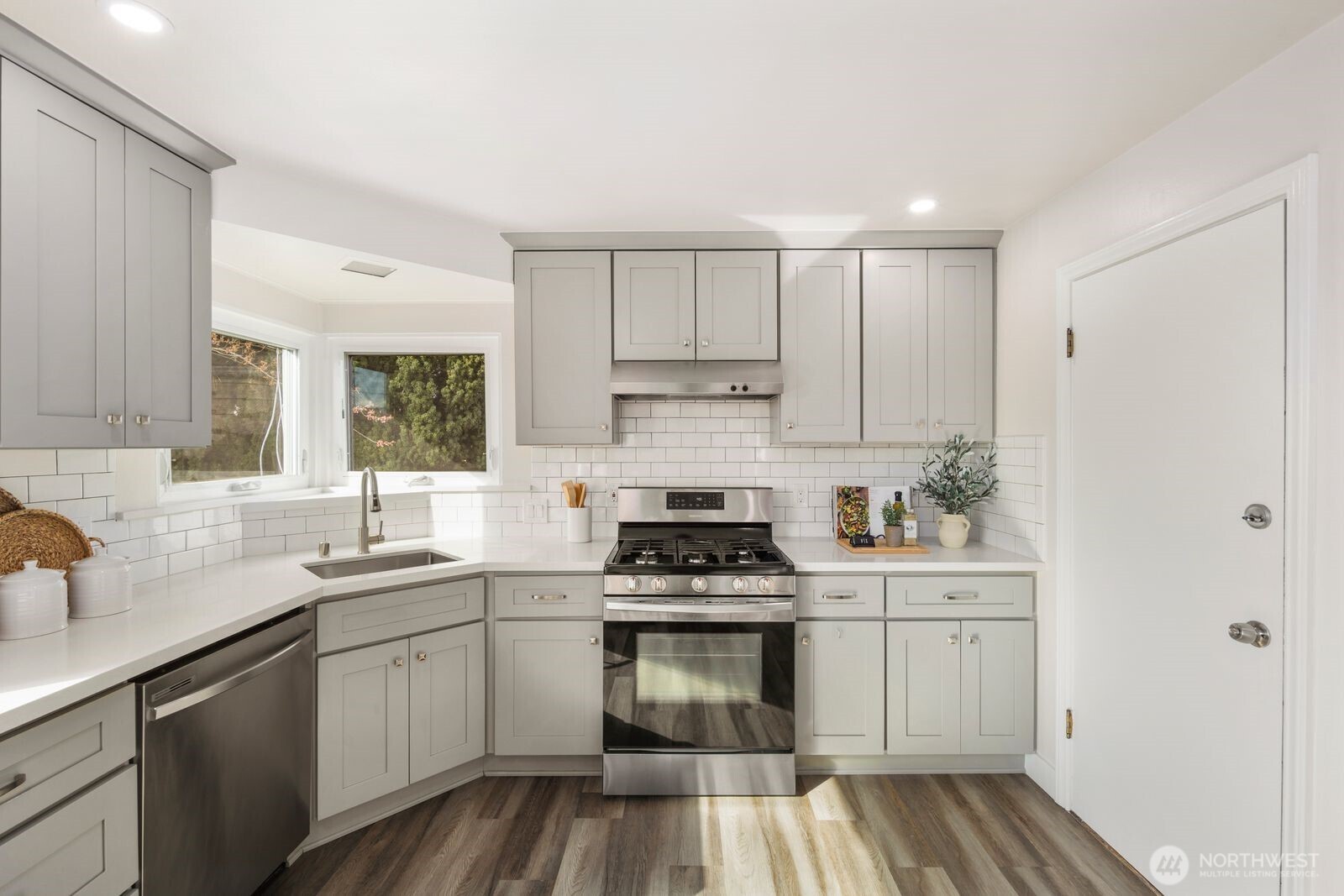 6023 35th Avenue Southwest Seattle, WA 98126 - Photo 14 of 38 a kitchen with cabinets appliances a sink and a window
