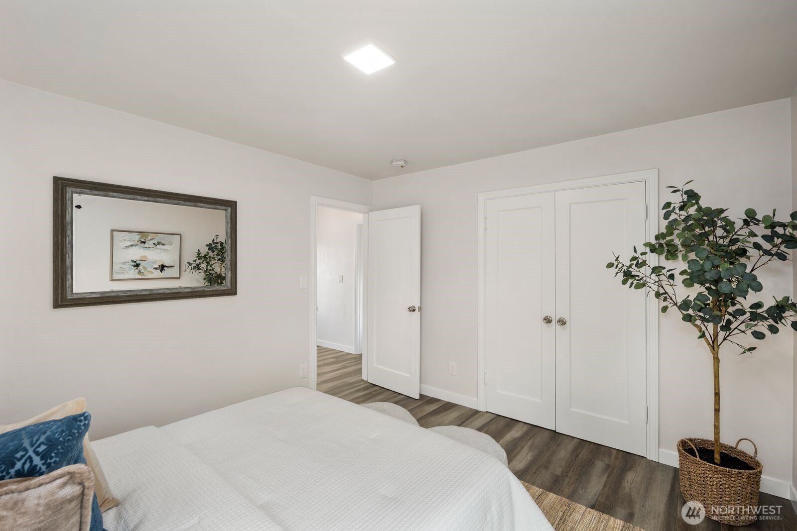 6023 35th Avenue Southwest Seattle, WA 98126 - Photo 17 of 38 a bedroom with a bed and a plant