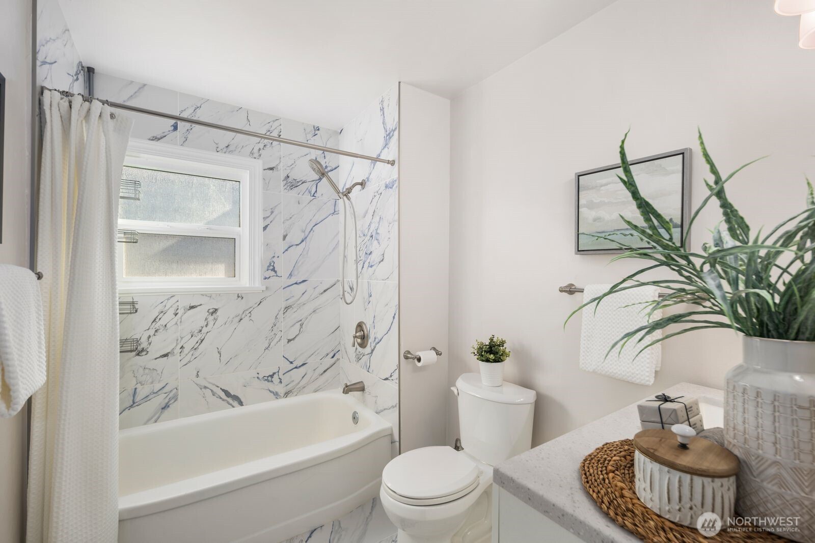 6023 35th Avenue Southwest Seattle, WA 98126 - Photo 18 of 38 a bathroom with a toilet a sink and bathtub