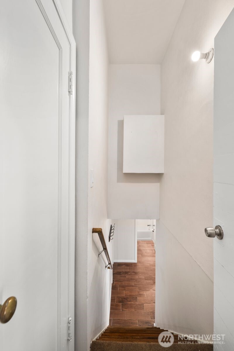 6023 35th Avenue Southwest Seattle, WA 98126 - Photo 22 of 38 a view of a hallway with wooden floor