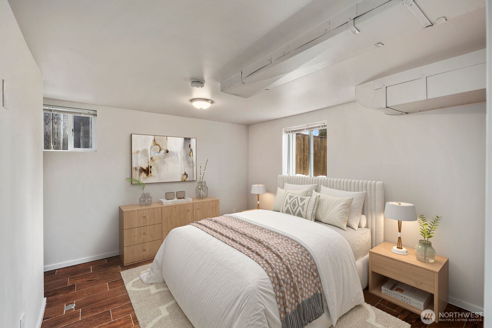 6023 35th Avenue Southwest Seattle, WA 98126 - Photo 27 of 38 a bedroom with a large bed and a window