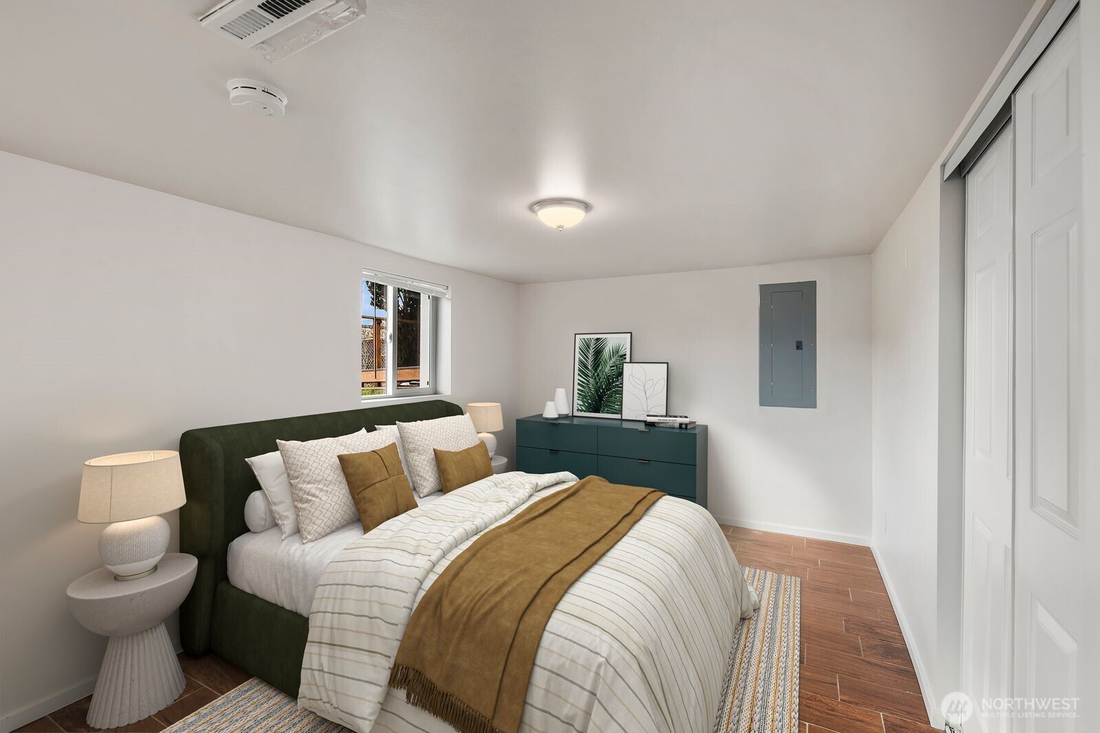 6023 35th Avenue Southwest Seattle, WA 98126 - Photo 28 of 38 a bedroom with a bed and a window