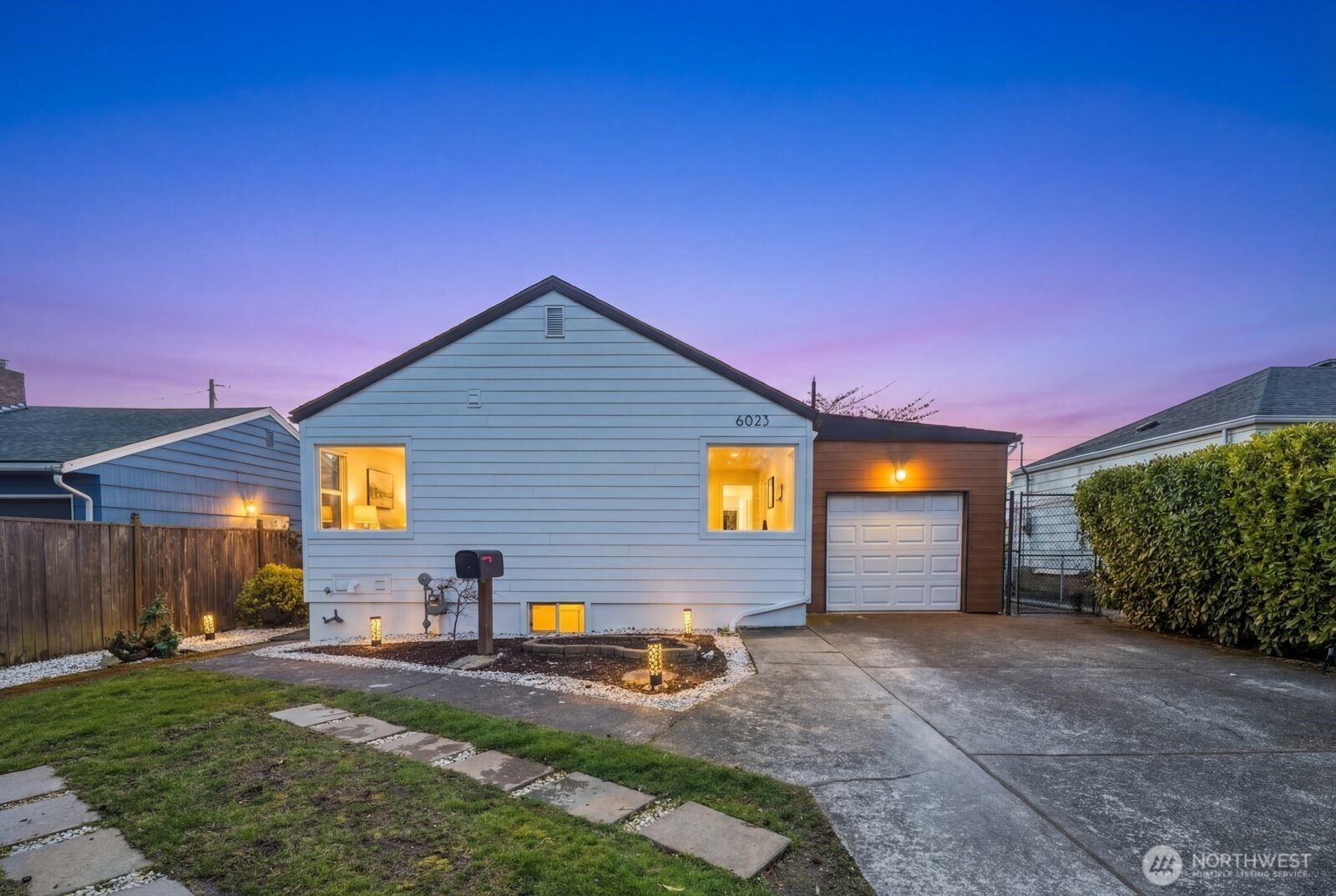 6023 35th Avenue Southwest Seattle, WA 98126 - Photo 35 of 38 a view of a house with backyard and a tree