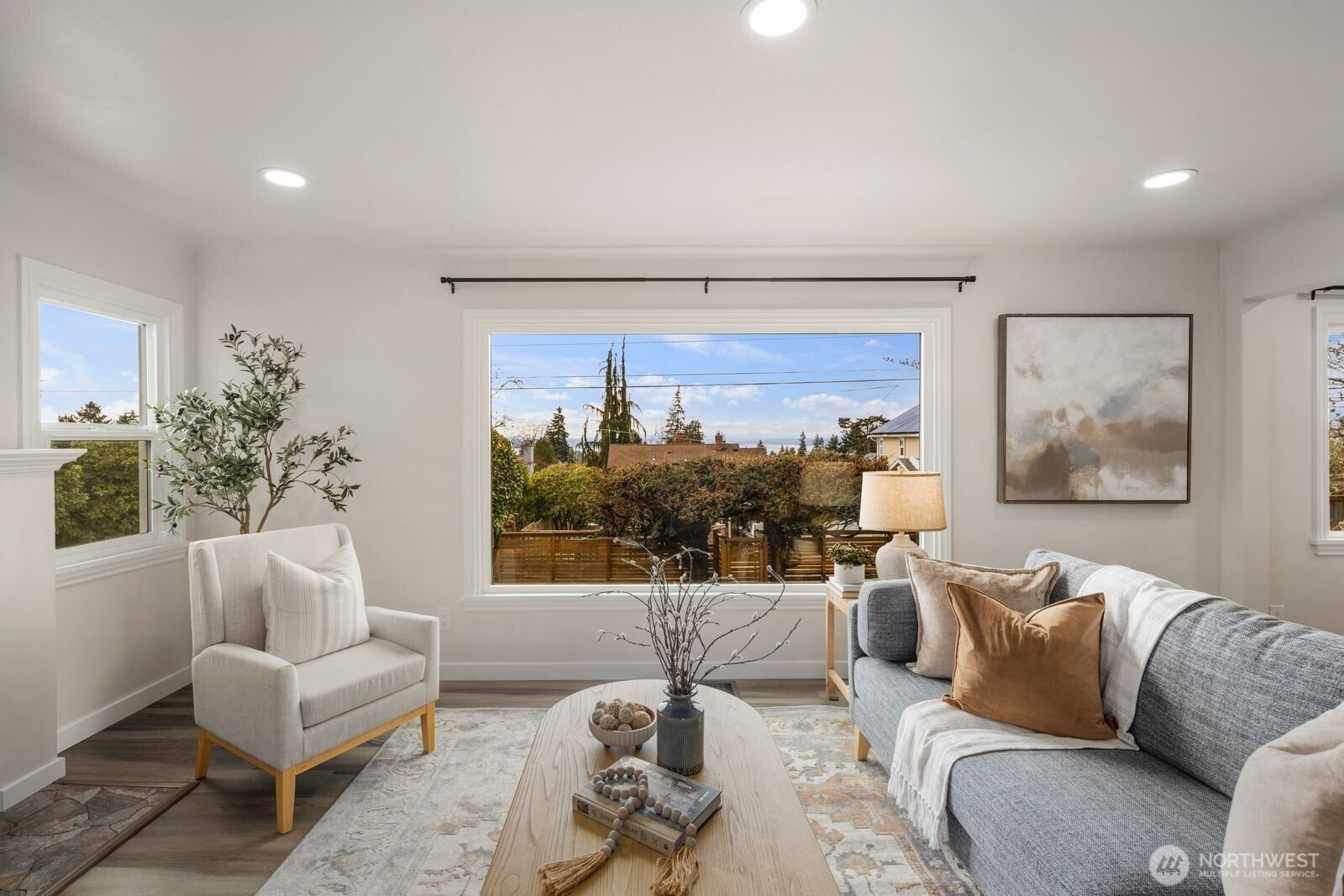 6023 35th Avenue Southwest Seattle, WA 98126 - Photo 5 of 38 a living room with furniture and a large window