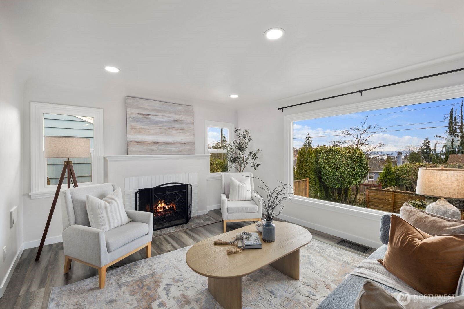 6023 35th Avenue Southwest Seattle, WA 98126 - Photo 6 of 38 a living room with furniture and a fireplace