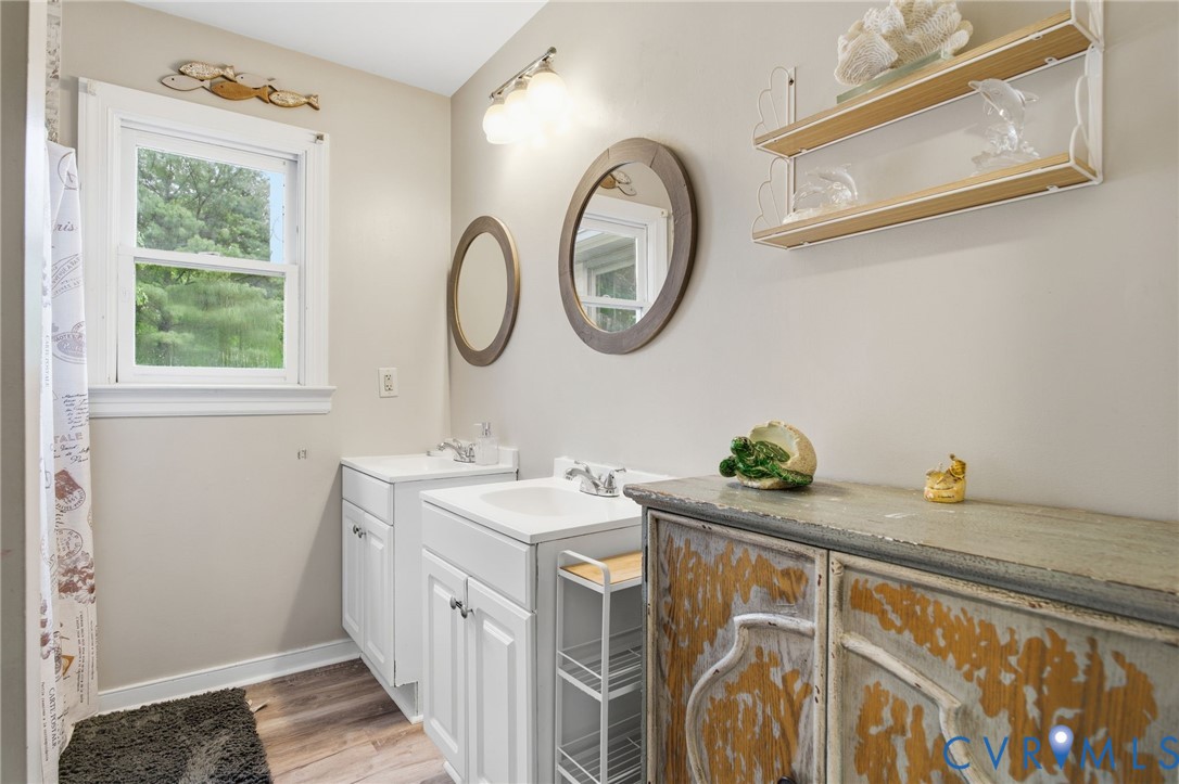 9110 Gayton Road Henrico, VA 23229 - Photo 33 of 54 a bathroom with a sink and a mirror