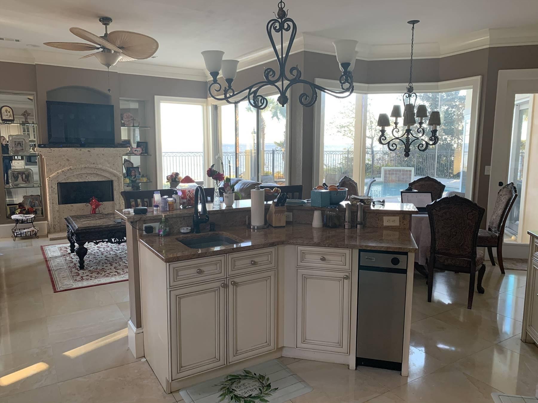 1239 Driftwood Point Road Santa Rosa Beach, FL 32459 - Photo 18 of 33 a kitchen with sink cabinets and outdoor view