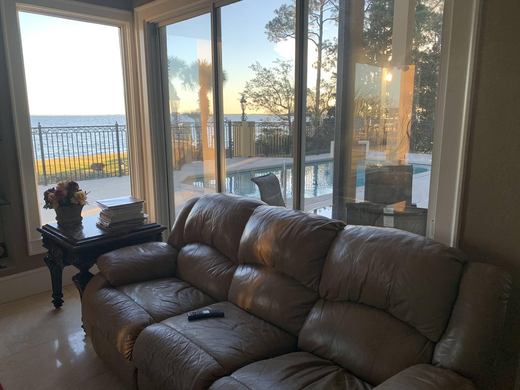 1239 Driftwood Point Road Santa Rosa Beach, FL 32459 - Photo 19 of 33 a living room with furniture and a floor to ceiling window