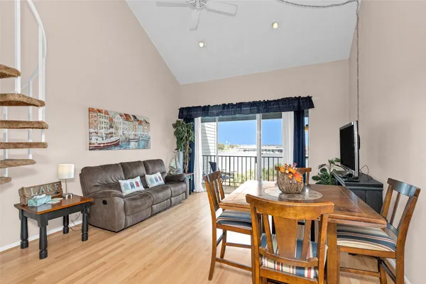 a view of a livingroom with furniture and a flat screen tv