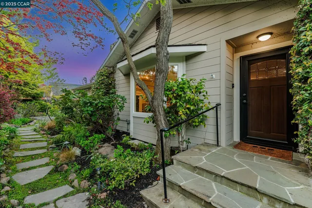 a house with a tree in front of it