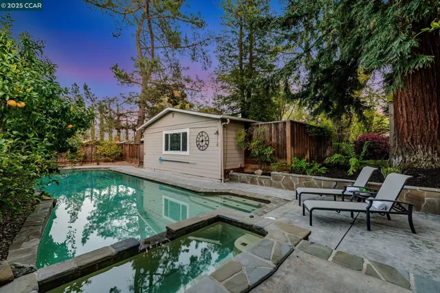 a view of backyard with a patio and outdoor seating