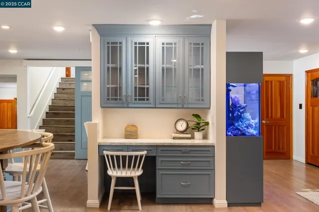 a view of kitchen with furniture and wooden floor
