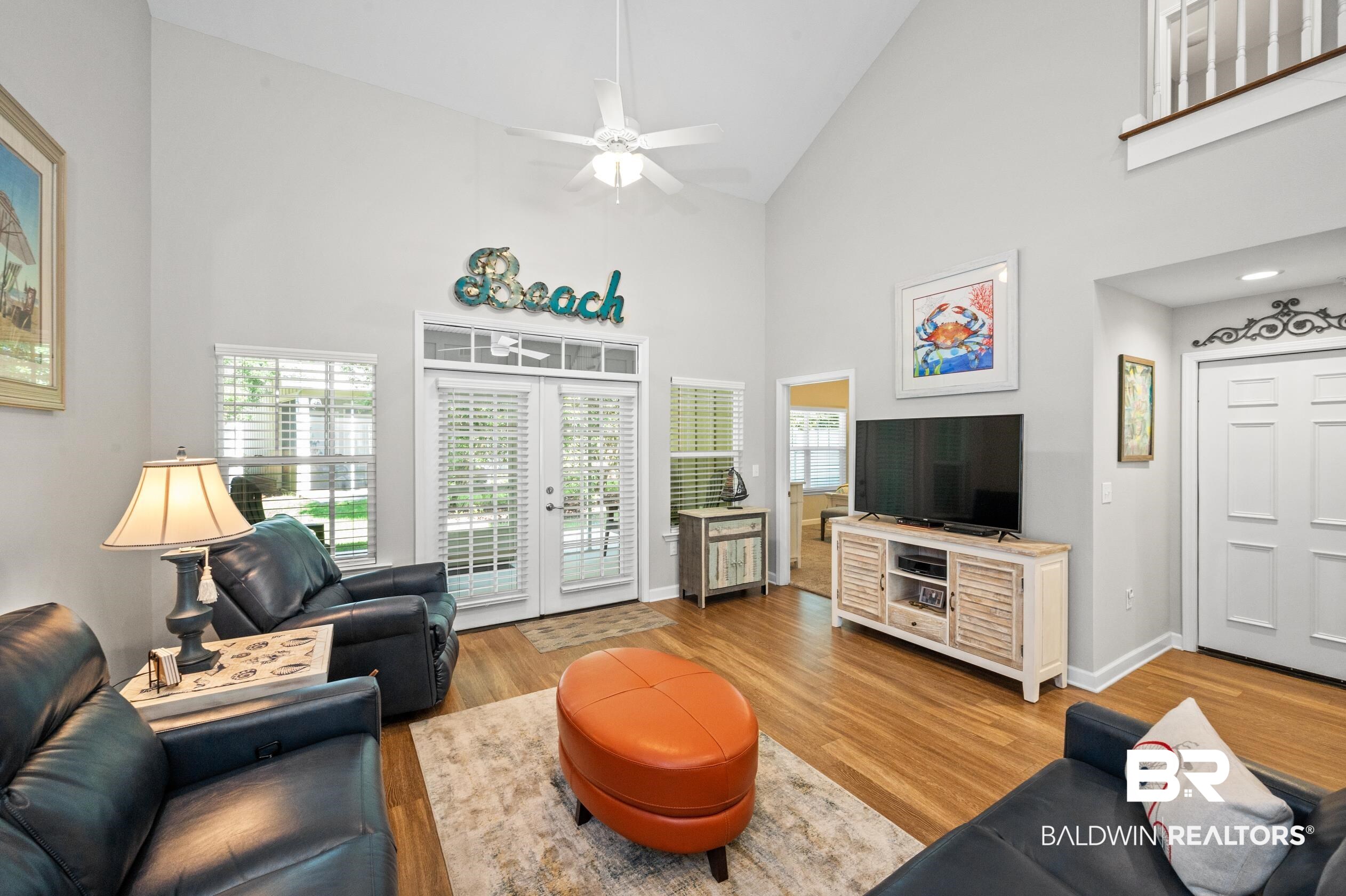 430 West Fort Morgan Road, Unit 1902 Gulf Shores, AL 36542 - Photo 7 of 59 Living room with light hardwood / wood-style floors, french doors, ceiling fan, and high vaulted ceiling