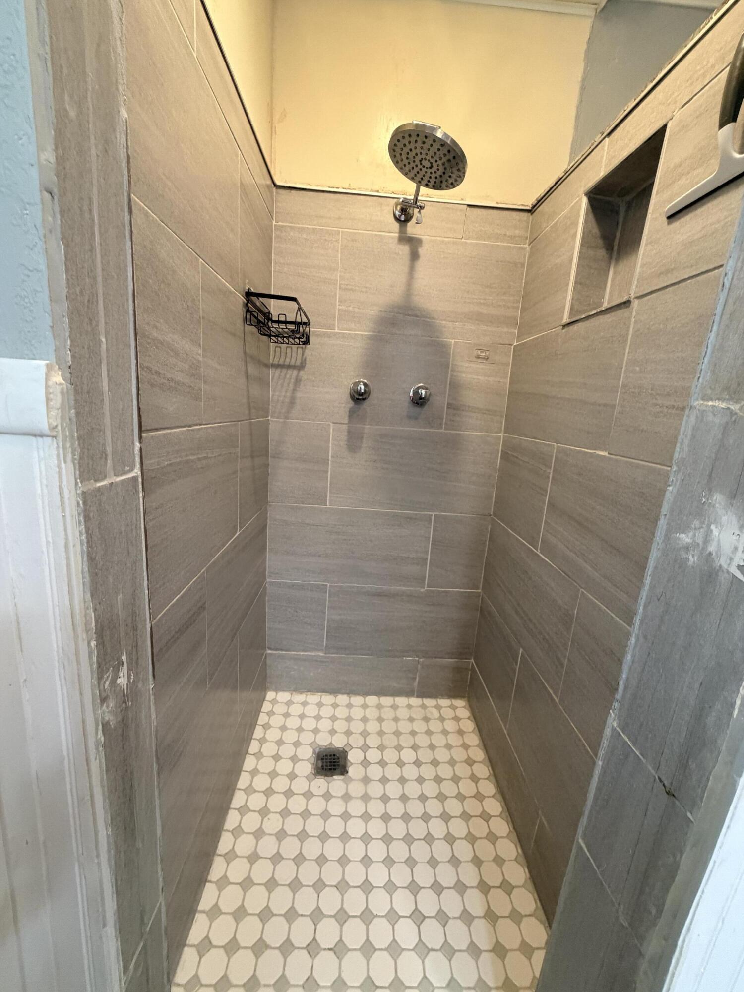 3814 27th Street Lubbock, TX 79410 - Photo 15 of 24 a bathroom with a shower