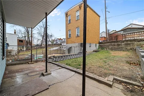 a view of a porch with a floor to ceiling window