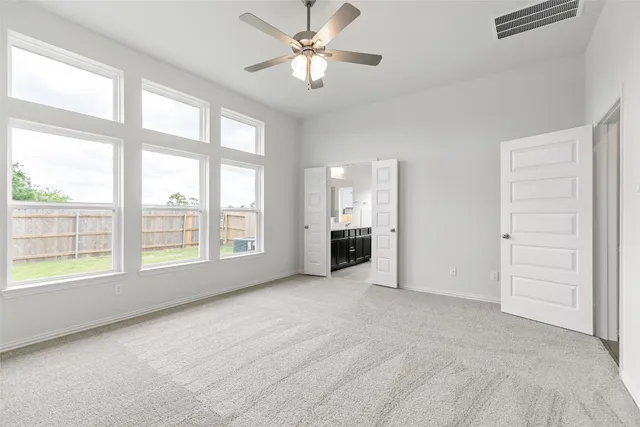 a view of a room with cabinet and windows