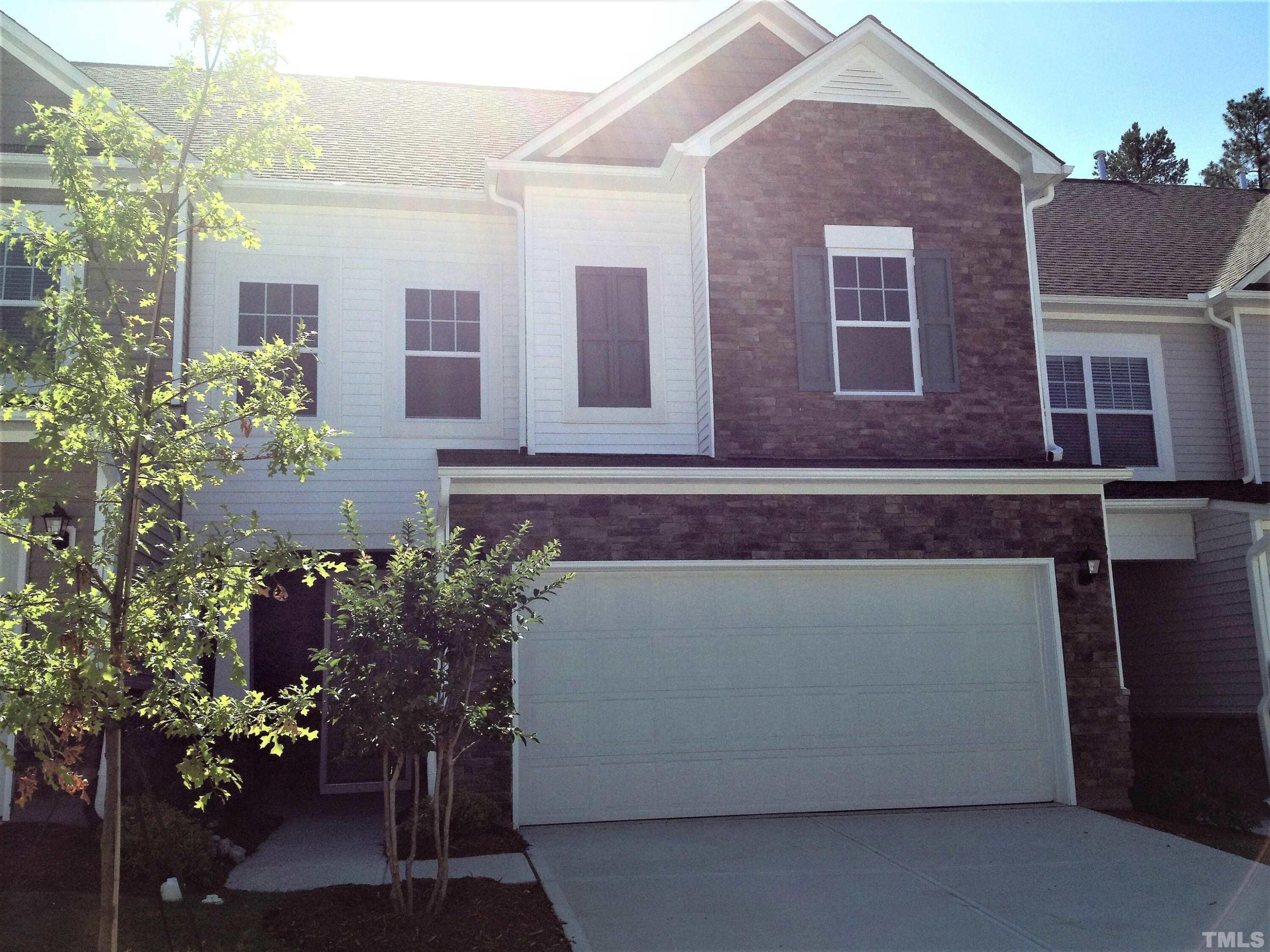226 Skyros Loop Cary, NC 27519 - Photo 1 of 14 a front view of a house with a yard