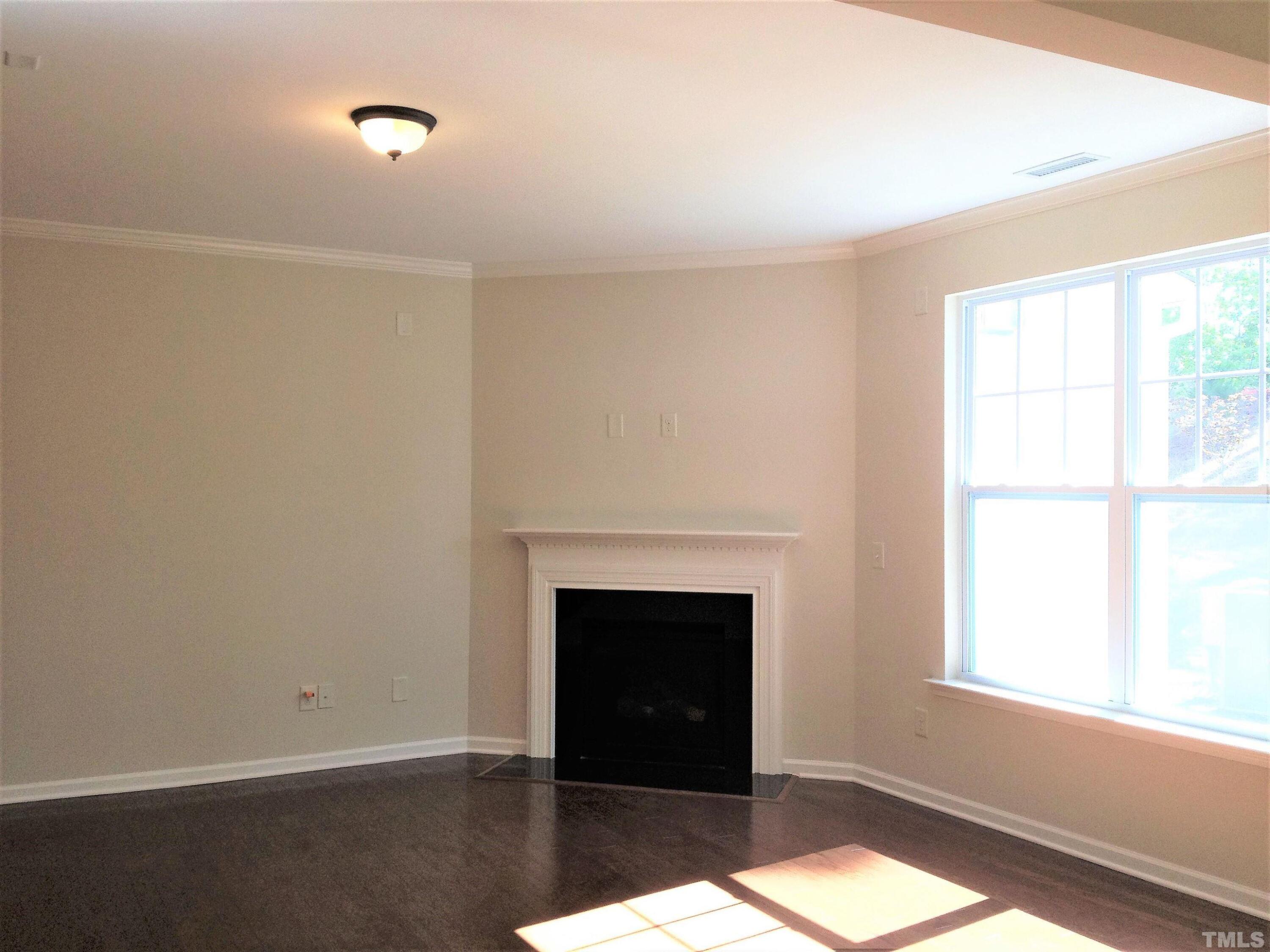 226 Skyros Loop Cary, NC 27519 - Photo 3 of 14 a view of an empty room with a window