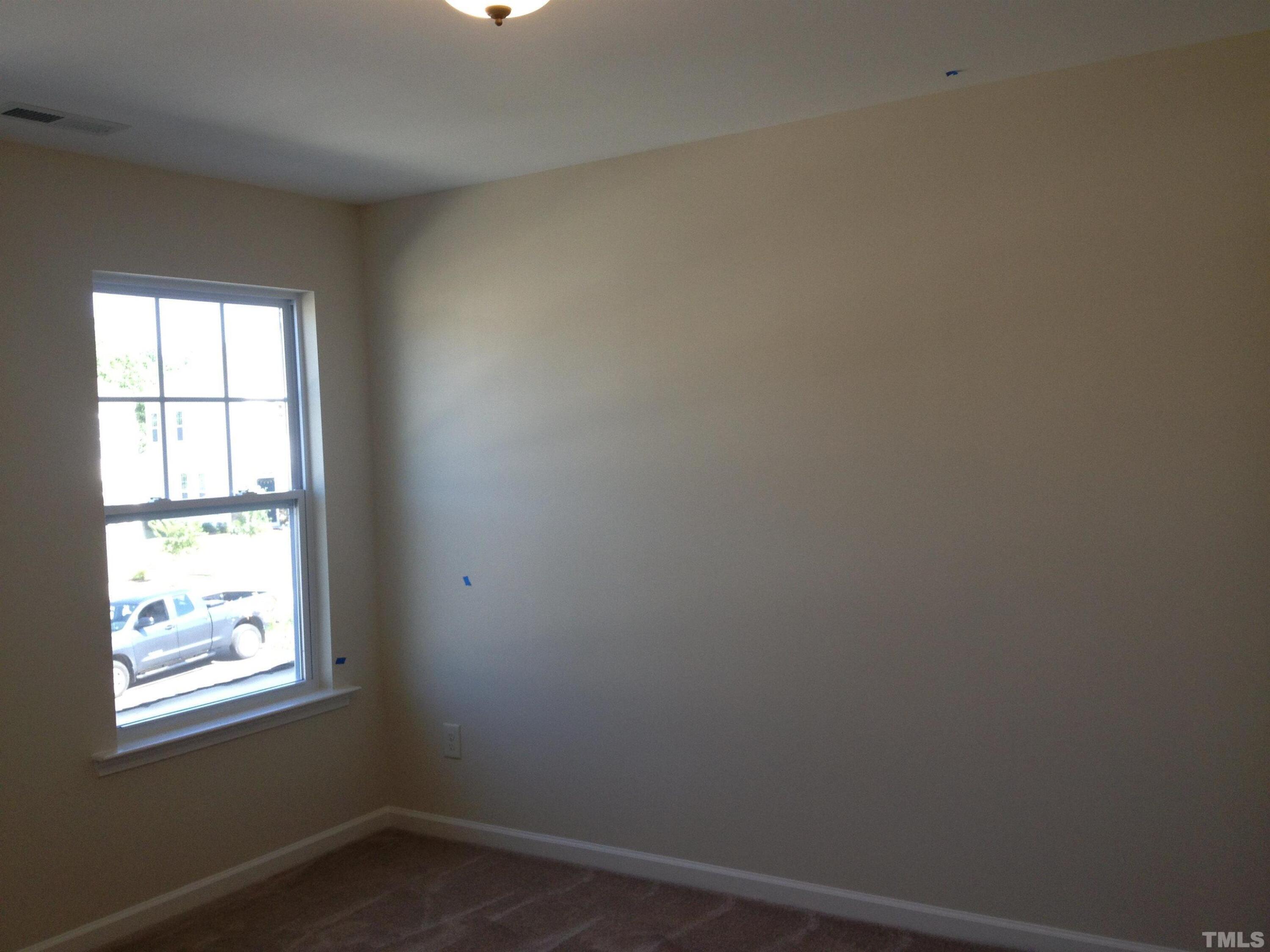 226 Skyros Loop Cary, NC 27519 - Photo 8 of 14 an empty room with a window