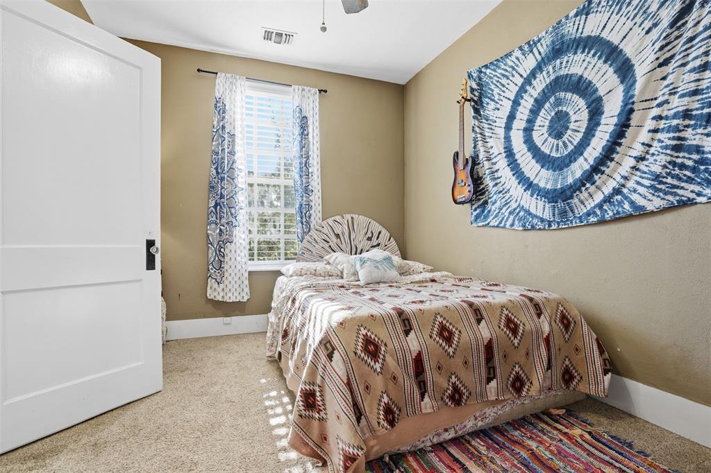 114 S Field Cleburne, TX 76033 - Photo 15 of 23 a bedroom with a bed and a window