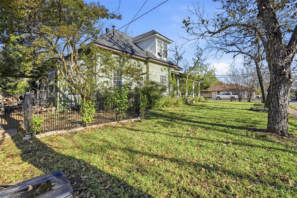 114 S Field Cleburne, TX 76033 - Photo 22 of 23 a backyard of a building with trees