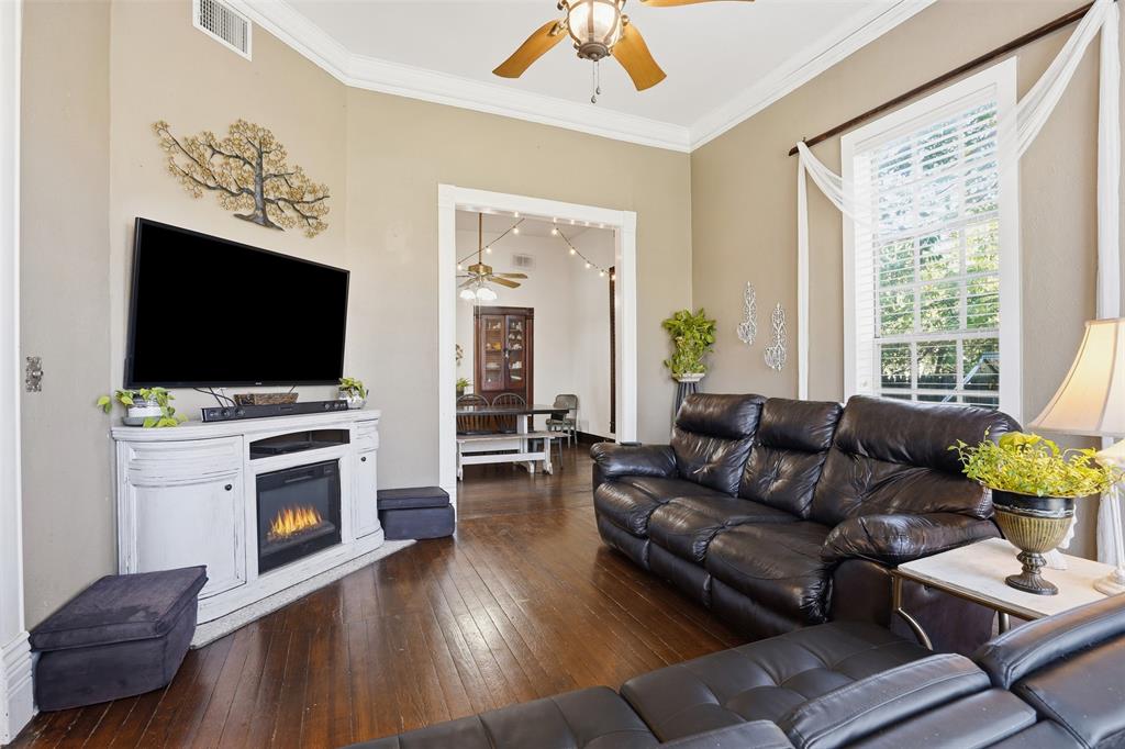 114 S Field Cleburne, TX 76033 - Photo 4 of 23 a living room with furniture and a flat screen tv