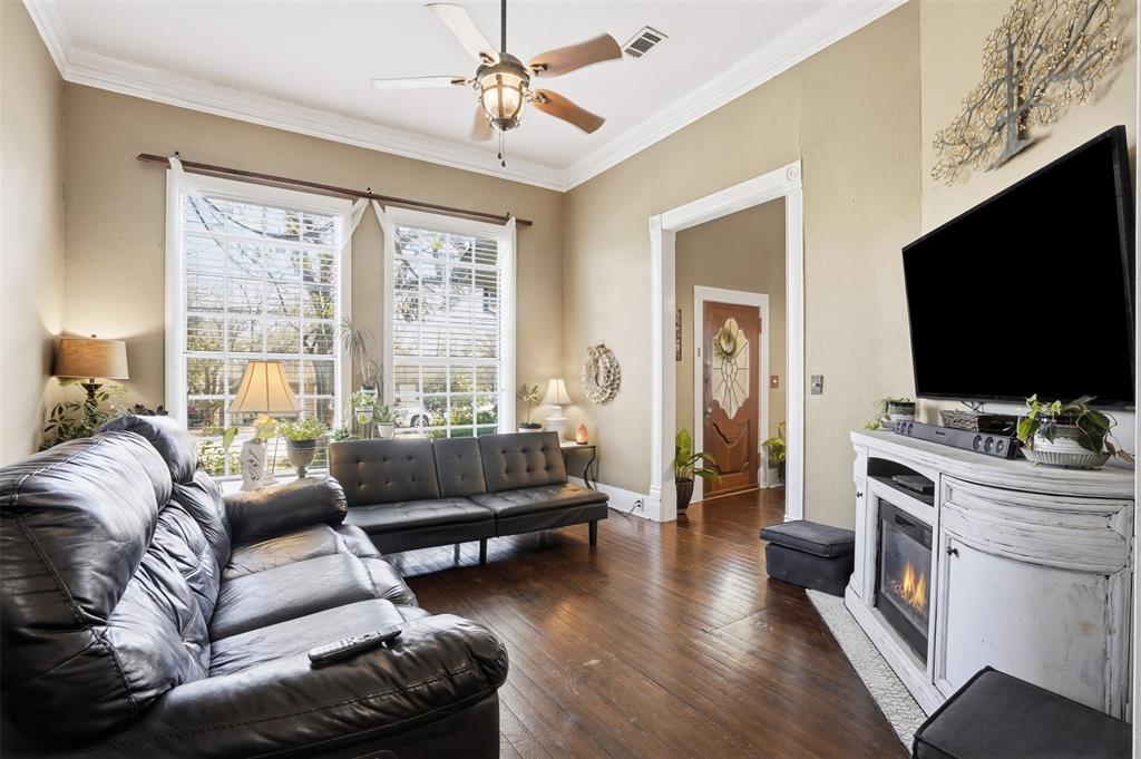 114 S Field Cleburne, TX 76033 - Photo 5 of 23 a living room with furniture and a flat screen tv