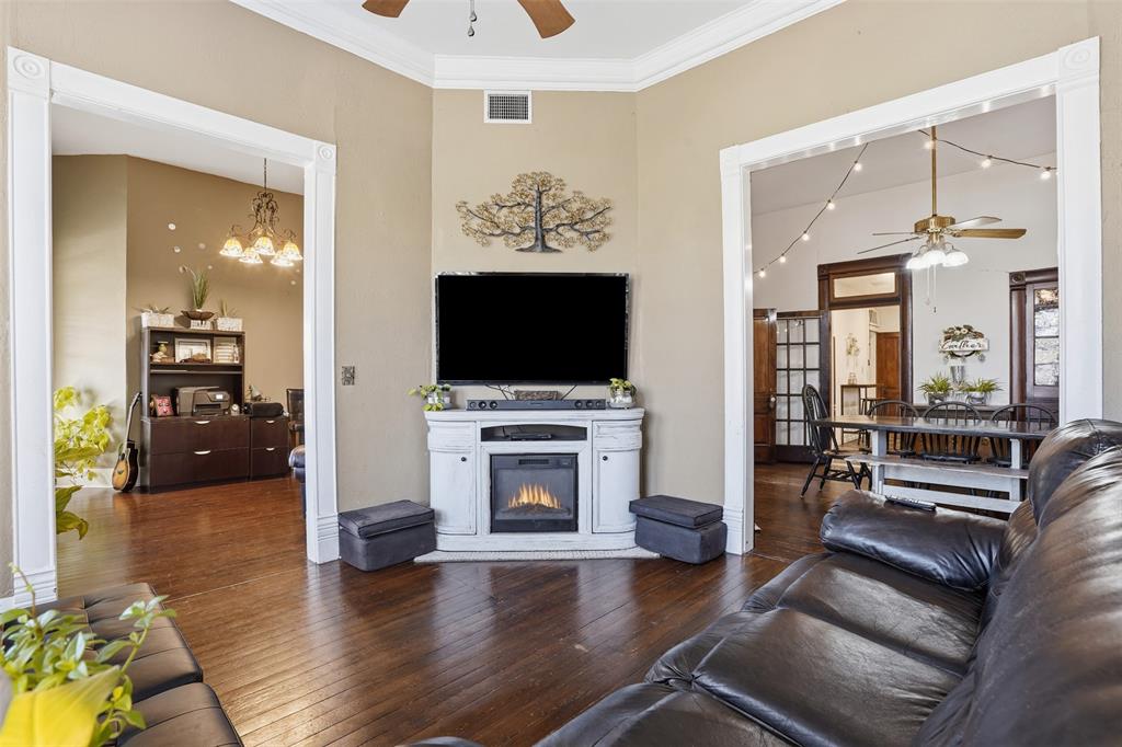 114 S Field Cleburne, TX 76033 - Photo 6 of 23 a living room with furniture and a flat screen tv