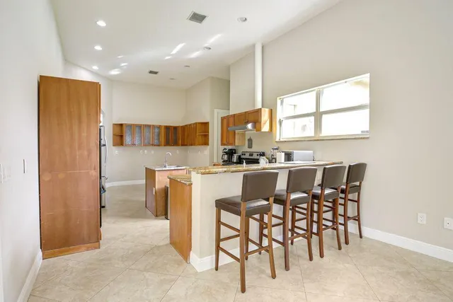 a kitchen with a table and chairs in it